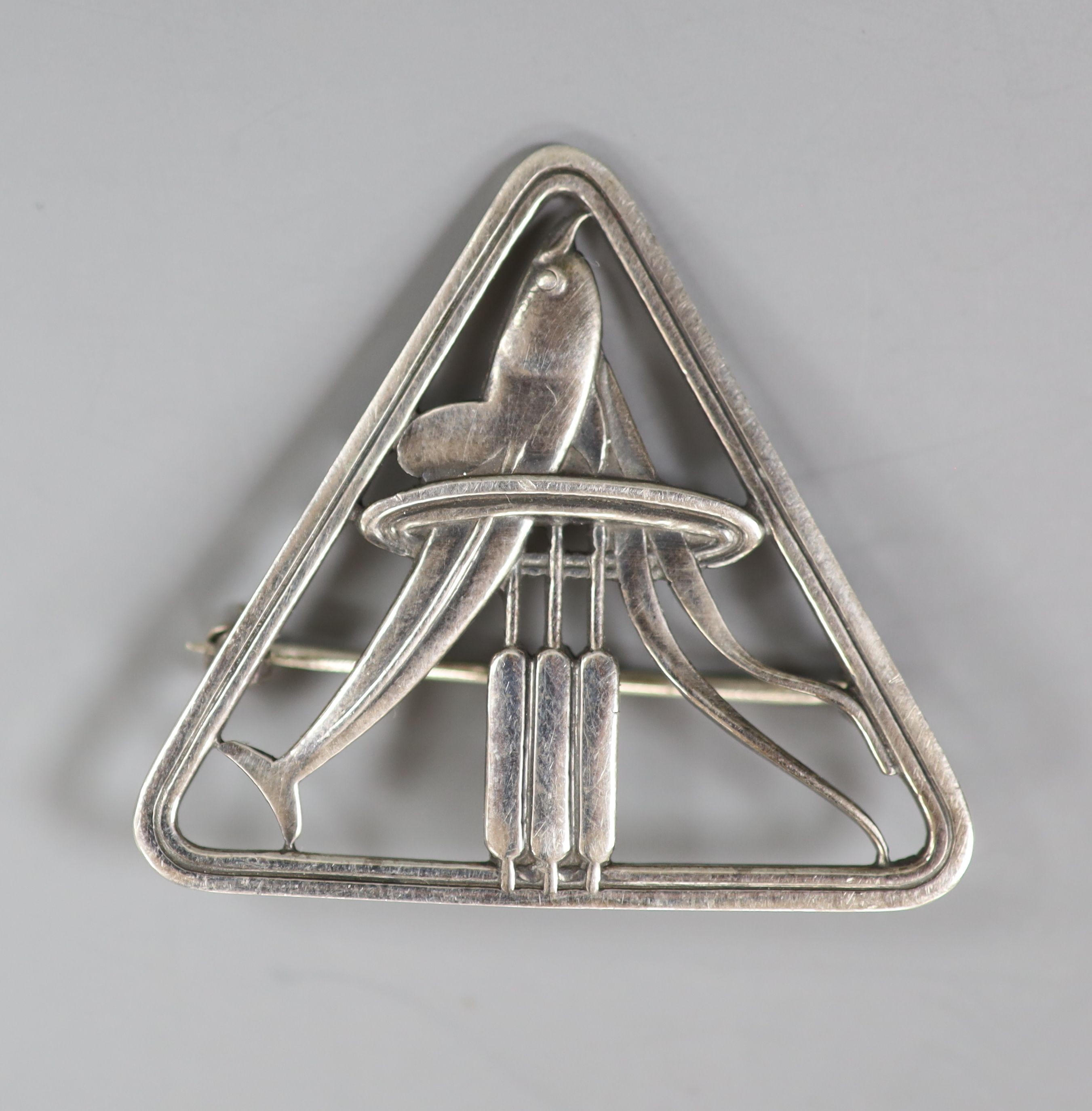 A Georg Jensen sterling dolphin amongst reeds brooch, no. 257, 41mm.